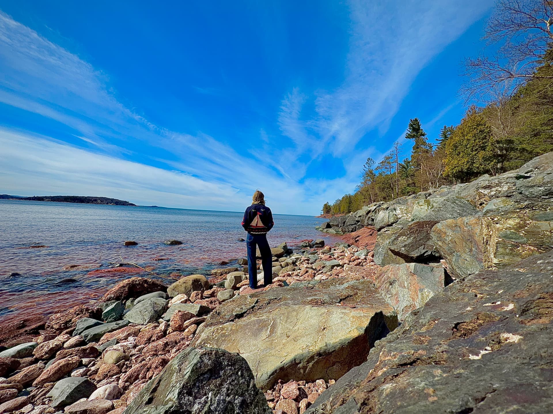 Leah Kirchhoff standing on a Lake Superior shoreline
