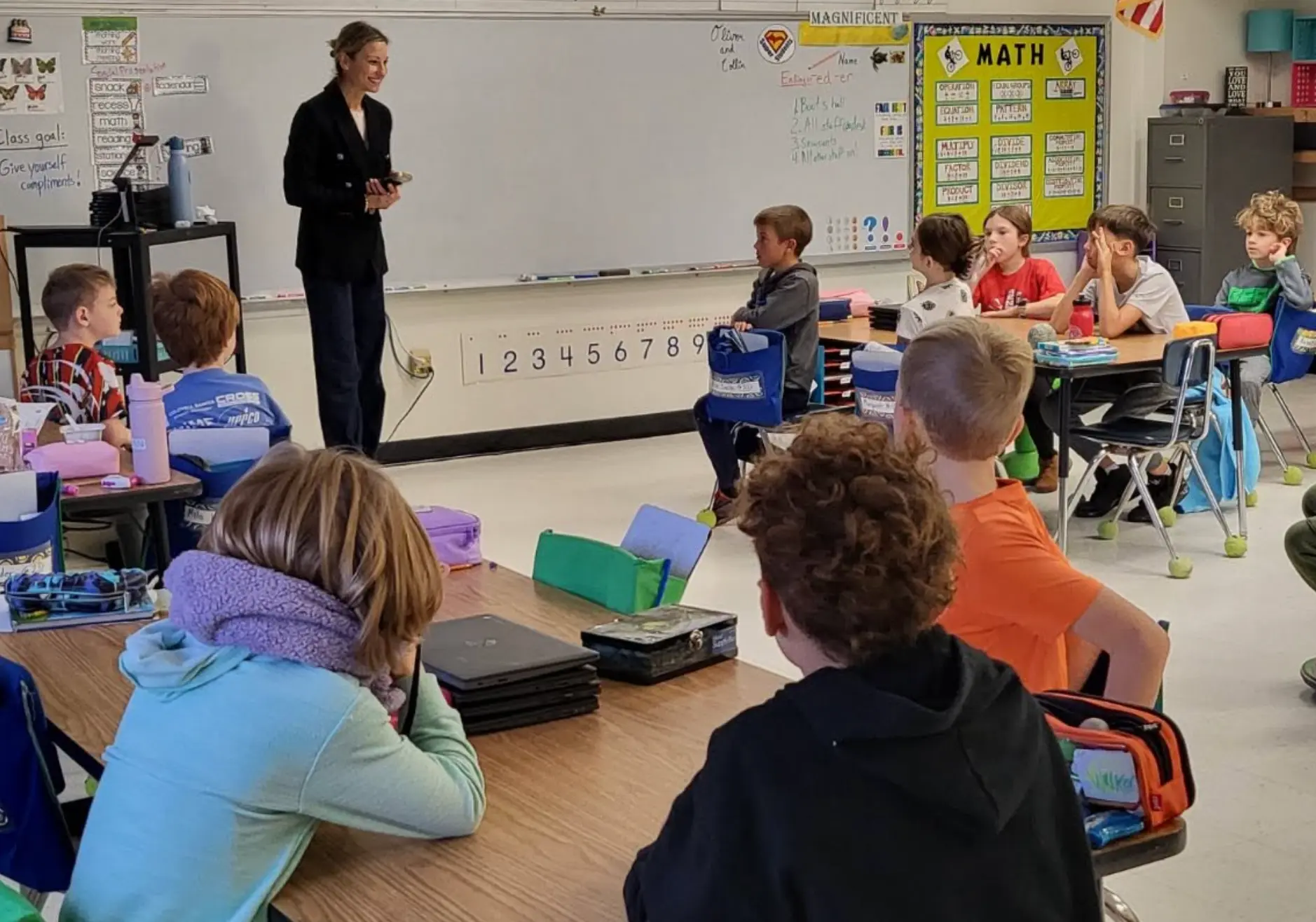 Leah Kirchhoff presenting a Project GL session to a classroom of students